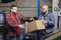 Two men working in a warehouse.