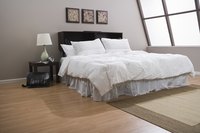 An L-shaped master bedroom allows you to create two separate spaces in your room.