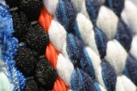 Make a rag rug using old jeans.