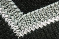 Mitered corners are used in a variety of projects besides blankets, as in this neck ribbing.