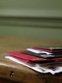 An envelope sealed with a personalized wax stamp makes a card stand out in a pile.
