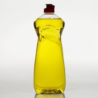 Grease-fighting dish soap is the key to removing set in grease stains.