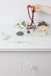Reorganize your jewelry box separating your pendants, amulets and medallions.