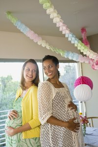 Before purchasing decorations, write out your baby shower invitations.