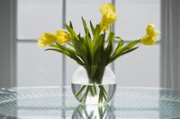 A simple vase of seasonal flowers makes an elegant but inexpensive centerpiece.