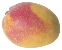 Alphonso mangoes have a red and yellow skin similar to the one pictured.