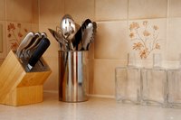 Create room for a ceramic backsplash by removing the preformed backsplash on your countertop.