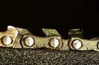 File the chain saw blade cutters with even and equal strokes.