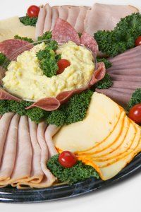 Display cold cuts in an attractive arrangement.