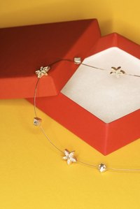 Jewelry displays and packaging enhance eye appeal.