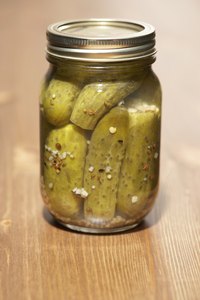 Pack pickles uniformly and leave space for brine.