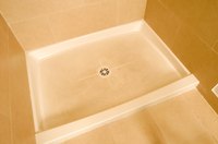 Fiberglass shower pans can crack or discolor.