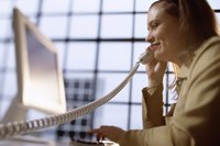 Woman on phone at computer