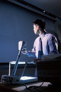 Set up and test the overhead projector.