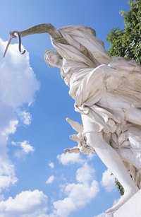 A marble statue will not deter snakes like well managed ground cover.