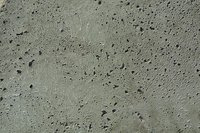 Pits form in frozen concrete.