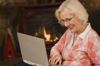 A mature woman on the computer.