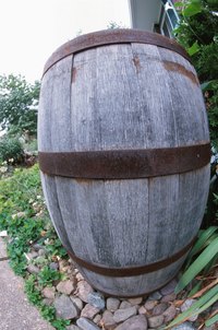Use gravity to move water from a rain barrel to a water feature.