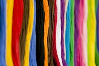 Bind off a kid's loom weaving by drawing one loop through another.