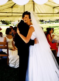 Use draping to decorate a tent for a wedding reception.