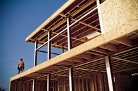 Contractor standing on construction site.
