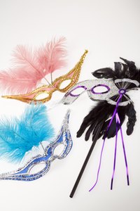 Attach a stick to your mask to create a handle.