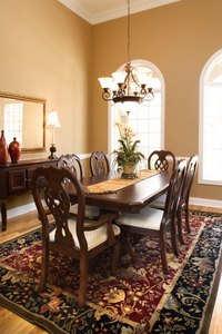 Traditional furnishings and lush carpeting give the dining room a formal air.