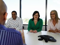 Business employees and manager are having a discussion.