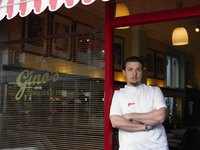 Owner standing in door of barber shop