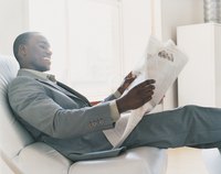 Businessman reading a newspaper.
