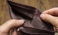 Hands opening an empty wallet.