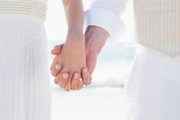 Husband and wife holding hands.