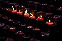 Candles lit in church.