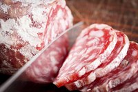 Italian salami's characteristic pink color comes from the curing process.