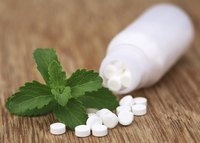 Stevia tablets on a wooden table.