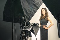 A solid colored top works best for a headshot because it won't distract attention from your face.