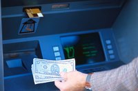 Man withdrawing cash from an ATM.
