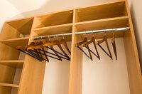 Add a wooden wardrobe to make another closet in the bedroom.