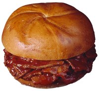 Thinly sliced or shredded brisket topped with BBQ sauce makes a delicious sandwich.