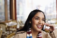 A young woman talking on a cell phone.
