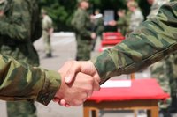 Soldiers shaking hands.
