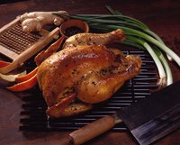 Roast a whole chicken with a rotisserie attachment on your gas grill.