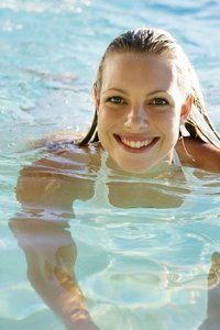 Cyanuric acid reduces the amount of chlorine needed to keep pool water clear.