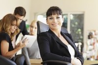Smiling EEOC lawyer in office.