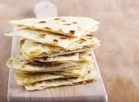 Pile of lefse on cutting board