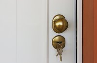 A close-up of keys in an apartment door.