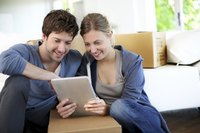 A young couple goes over the lease for their newly rented apartment
