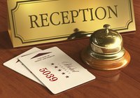 A close-up of hotel key cards at a concierge desk.