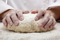 Knead the dough by hand on a flat, floured work surface until the dough is smooth and stretchy.