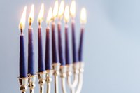 A close-up of a lit Menorah.
